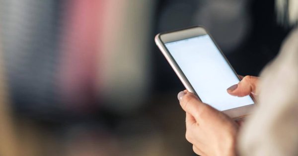 Person holding a mobile phone