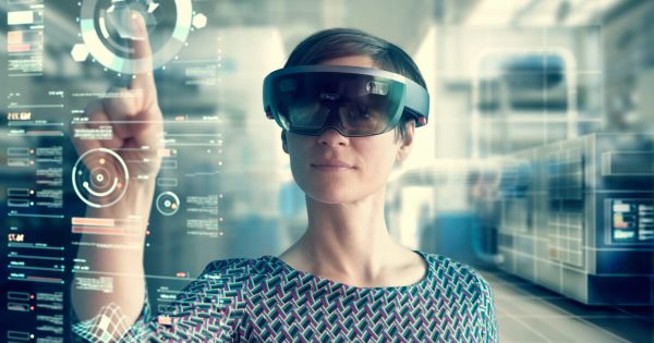 Women using a VR headset in a manufacturing environment
