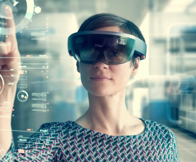 Women using a VR headset in a manufacturing environment