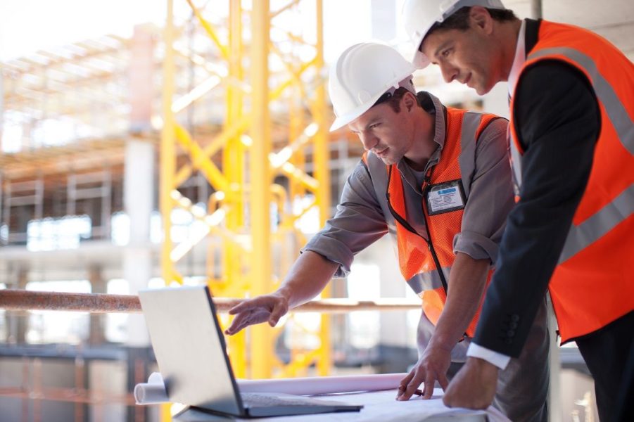 Construction Workers on Laptop