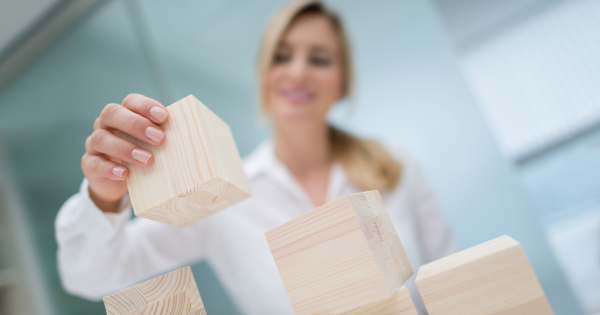 Woman stacking blocks