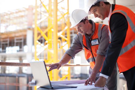 Construction site with digital tools representing construction digital transformation