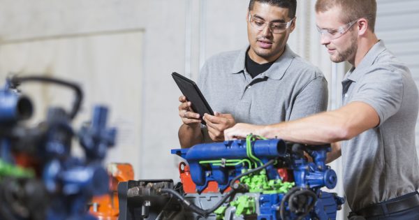 Engineers using their IFS Cloud systems to navigate remanufacturing.